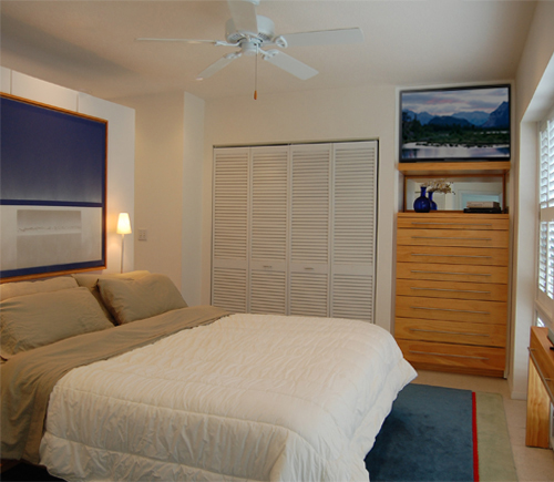 MASTER BEDROOM OVERLOOKING THE POOL