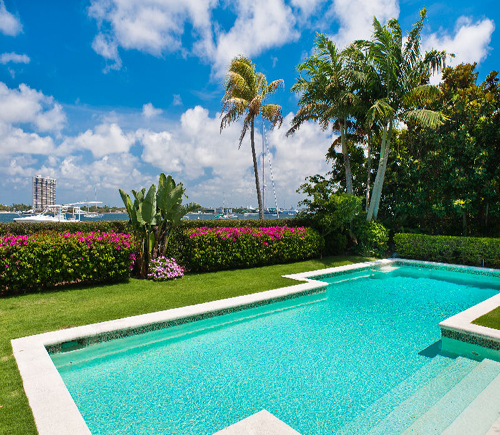 POOLSIDE OVERLOOKING WATERWAY